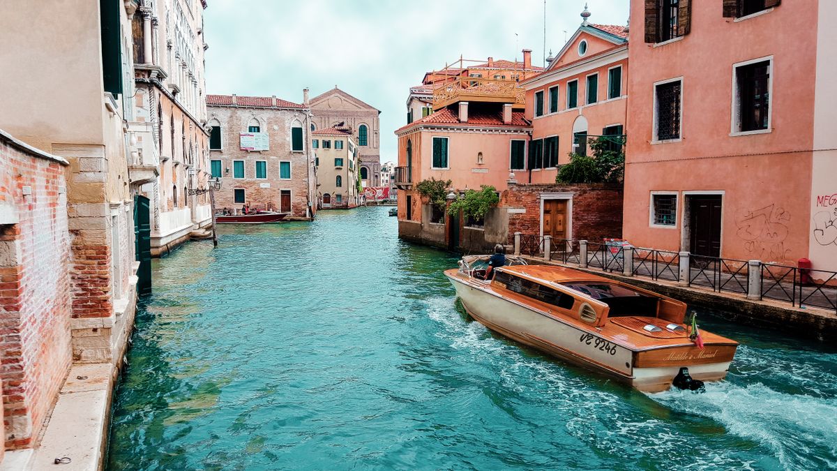 A canal between city buildings in Venice