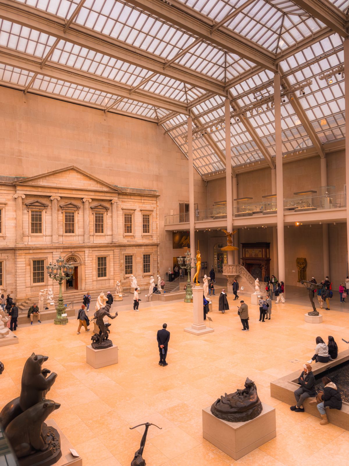 The interior of a museum with visitors and exhibition spaces