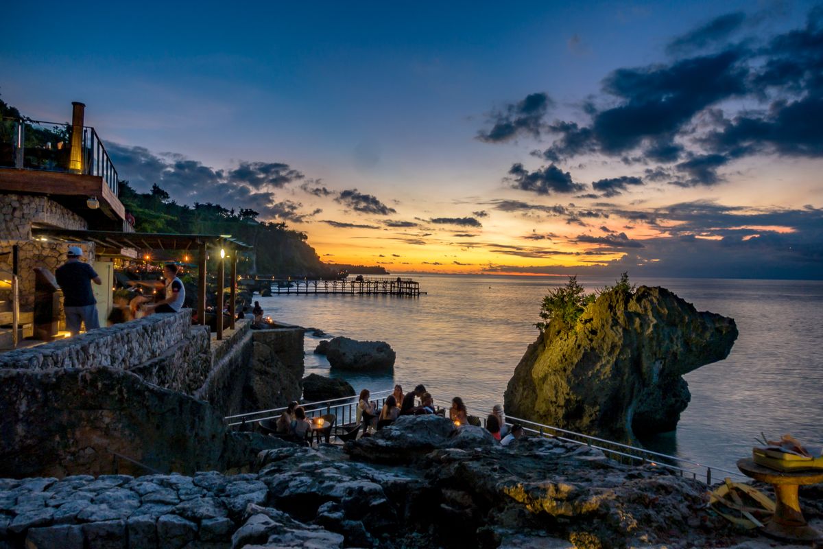Outdoor restaurant tables overlooking the sea